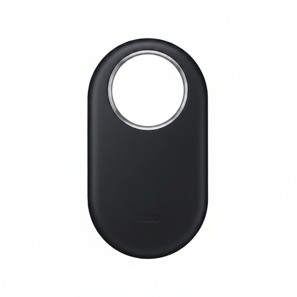 Top-down view of Samsung Galaxy SmartTag2 Black placed next to a Galaxy smartphone running the SmartThings Find app.