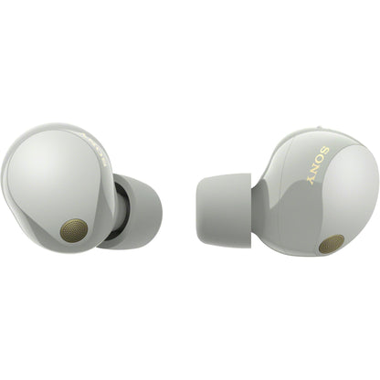 Side-angle view of silver WF-1000XM5 earbuds highlighting earbuds’ contours and case