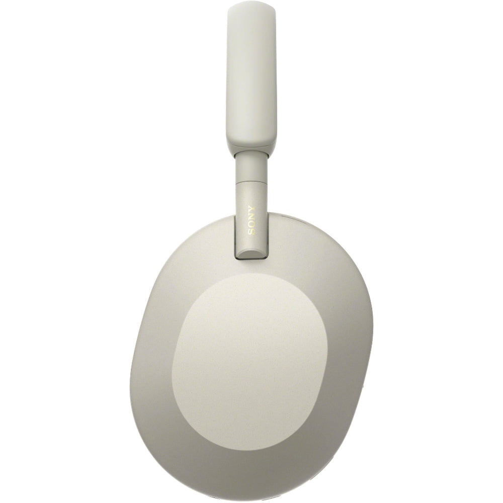 Side-angle of silver WH-1000XM5 showing earcup texture and padded headband