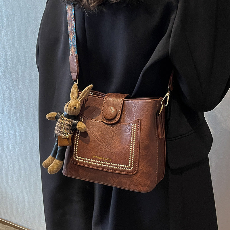 Vintage Style PU Leather Bucket Bag with Wide Patterned Strap & Optional Bunny Charm(black) Tristar Online
