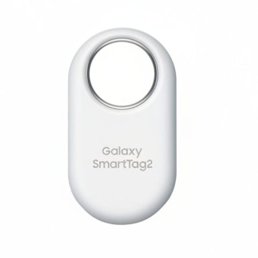 Samsung Galaxy SmartTag2 in White attached to a keyring, resting beside a Samsung Galaxy smartphone running SmartThings Find.