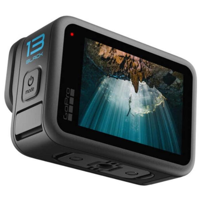 Compact GoPro HERO13 Black mounted on a helmet for outdoor filming.