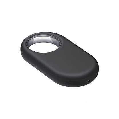 Close-up of the Samsung Galaxy SmartTag2 Black attached to a silver keyring with house keys.