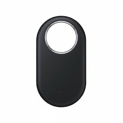 Top-down view of Samsung Galaxy SmartTag2 Black placed next to a Galaxy smartphone running the SmartThings Find app.