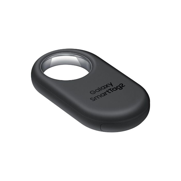 Close-up of the Samsung Galaxy SmartTag2 Black attached to a silver keyring with house keys.